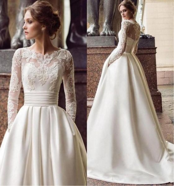 

2020 new design a line wedding dresses sheer neck long sleeves lace appliques beaded satin with pockets sweep train plus size brid9937252, White