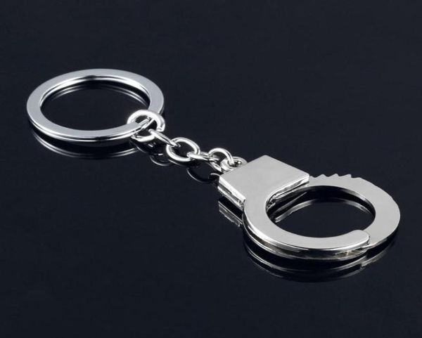 

100pcslot fashion metal handcuff keychains mini handcuff shaped keyrings key 2020new69780248355894, Slivery;golden