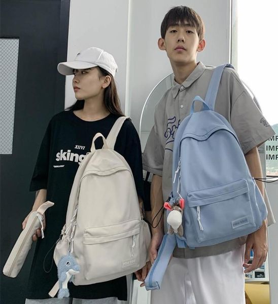 

school bags solid color fashion women backpack cute pendant bag for boys girls canvas large capacity lapcouple backpacks 20213939347