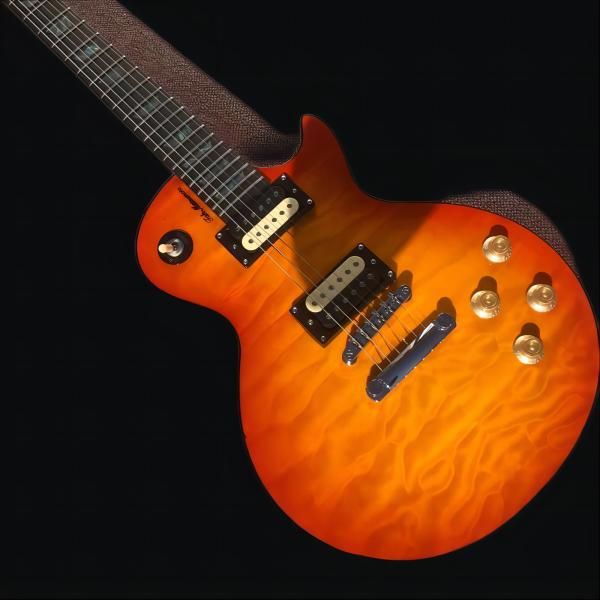 

electric guitar, rosewood fingerboard, one piece of body and neck, frets binding, tune-o-matic bridge, chrome hardware, cherry burst color,
