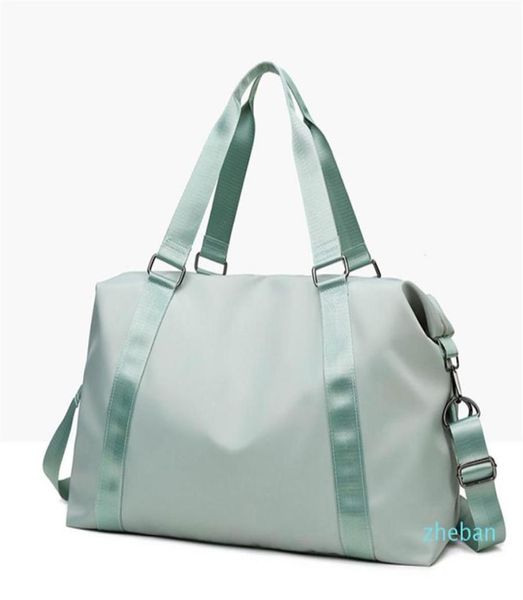 

whole hand yoga bag female wet waterproof large luggage bag short travel bag 502822 with brand logo316y6586289