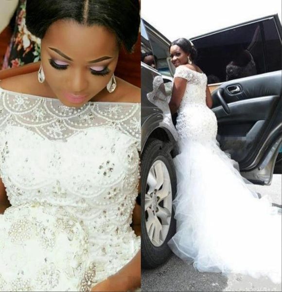 

2021 plus size african wedding dresses beading tiered short sleeves long chapel train tulle mermaid bridal gowns8767811, White