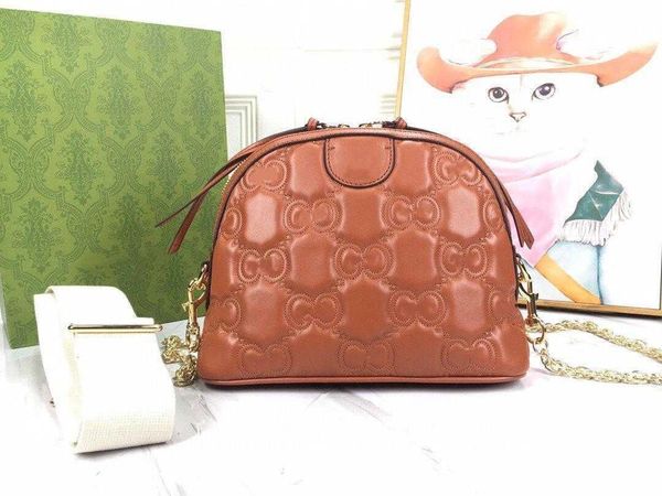 

gold dual g-tone accessory paired with shoulder straps