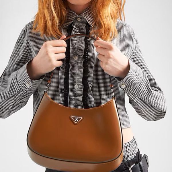 

handbag made of simple leather material with smooth surface and good texture. metal logo for women's crossbody bag