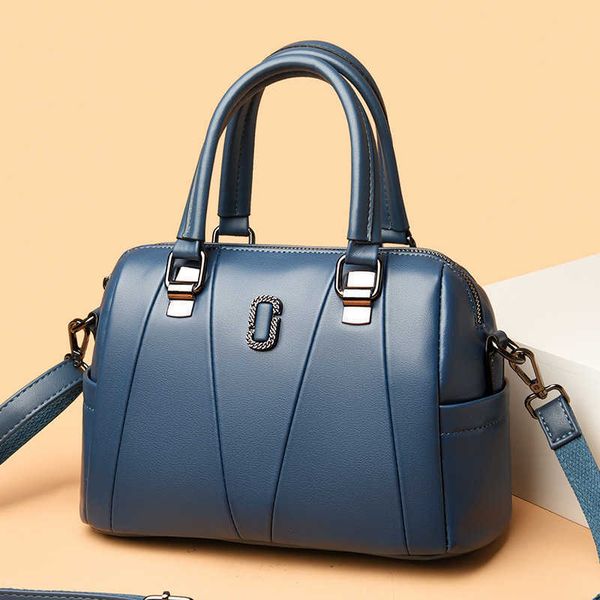 

2023jd boston pillow bag trendy metal flower genuine leather women's bag spliced v-cross shoulder handbag