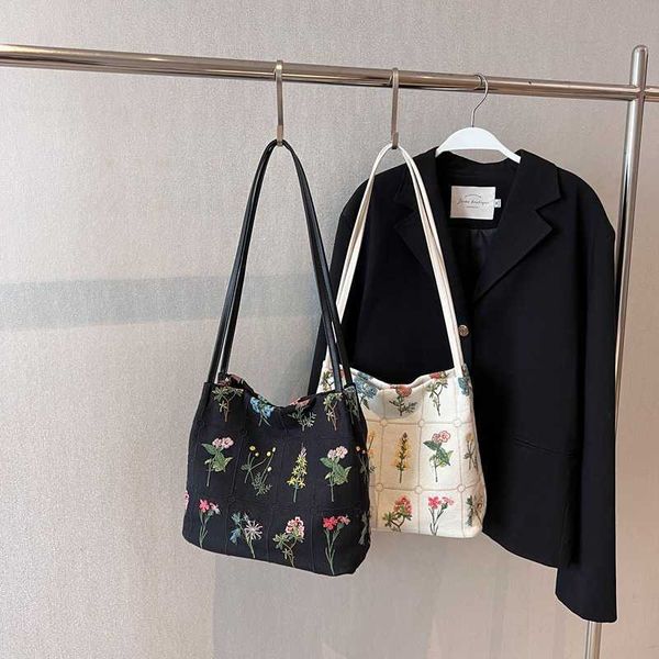 

large capacity versatile portable bag for women with embroidered design tote bag for spring/summer niche shoulder bag