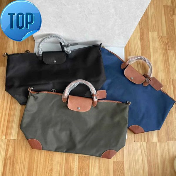 

high version cowhide with encrypted nylon large dumpling bag for men and women's travel capacity hand luggage