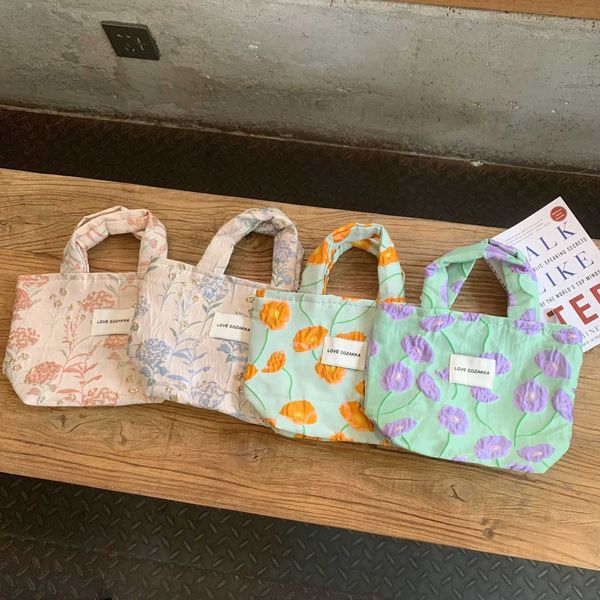 

2823 french embossed flower handheld portable bag women's simple portable handheld bag leisure walking bend handheld bag