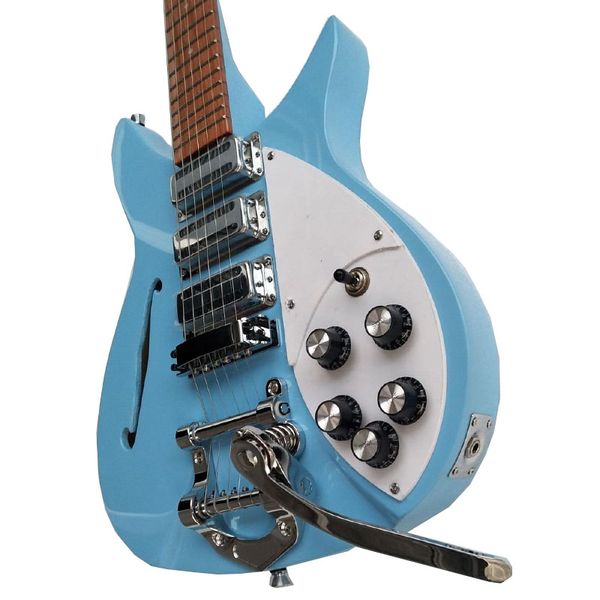 

semi hollow light blue electric guitar vibrato tail single f hole paint finger
