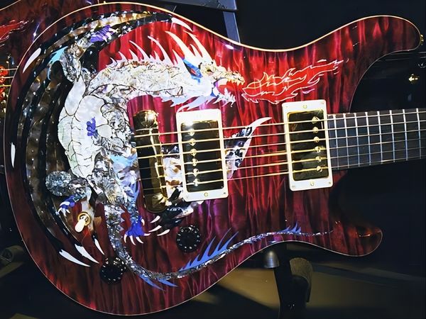 

dragon 2000 #30 red flame maple prs electric guitar no fretboard inlay,double locking tremolo, wood body binding