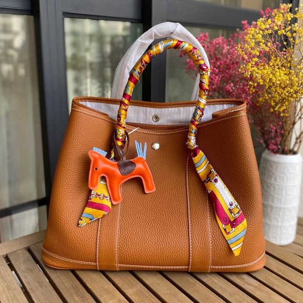

classic hemrres tote bags garden party leather garden new bag fashion simple large capacity portable tote wide shoulder strap commuting buck
