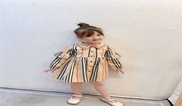 

designer girls plaid dresses 2021 autumn children ruffle long sleeve pleated dress kids cotton lapel singlebreasted clothing a7229906827, Red;yellow