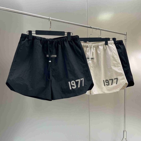 

fashion high street brand designer essentail sports shorts 1977 reflective print oversize hip hop loose nylon shorts clothing apparel essen, White;black
