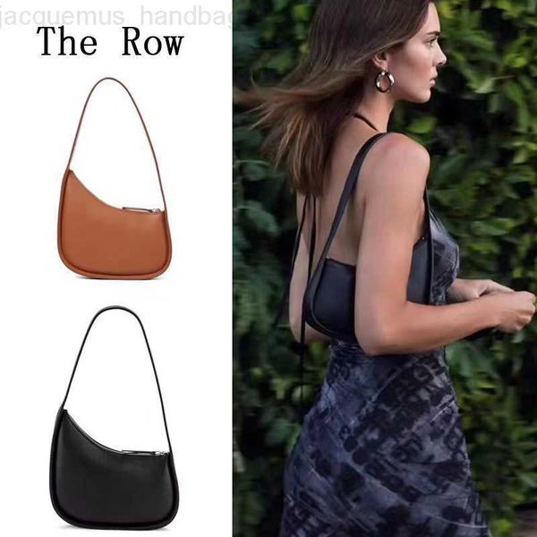 

the row half moon bag in smooth leather women designer with flat shoulder strap and curved zipper closure clutch tote underarm bags purse