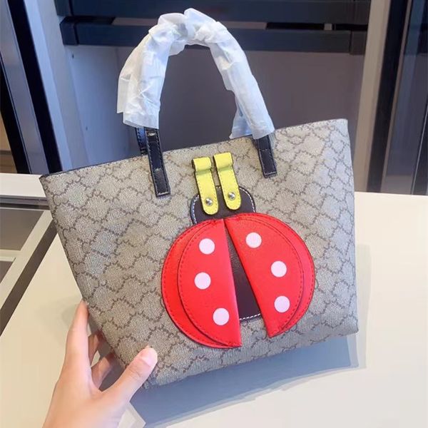 

2023 summer beautiful design children's shopping bag cartoon puzzle boutique handbag boys and girls tote bags designer shoulder bag wal