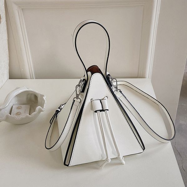 

evening bags fashionable triangle pu leather women s mini bag handbag and shoulder bag 230710