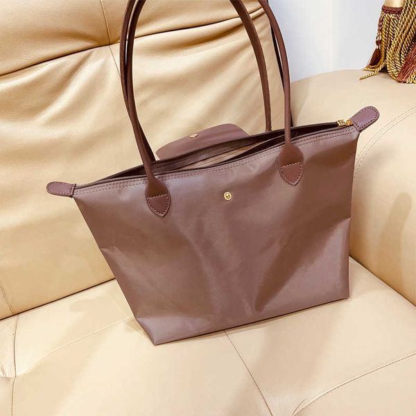 

xiaozhong new product medium size nylon dumpling bag women's fashion one shoulder large capacity mommy tote file bag information book b