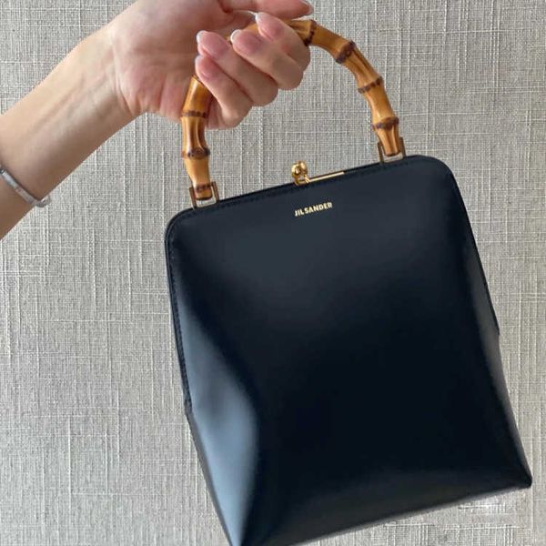 

jil sander new jil sander goji frame mouth gold bag bamboo festival hand held baguette bag women leather bag women summer