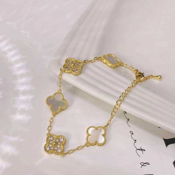 

tiktok net red same four-leaf clover female white shell with diamond four leaf flower light luxury style bracelet fashion handwear, Golden;silver