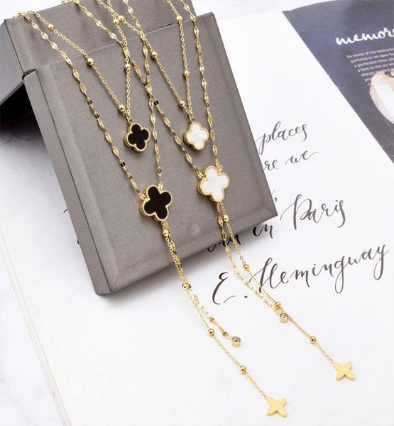 

european and american trendy jewelry black and white doublelayer doublesided fourleaf flower necklace presbyopic tassel pendant5690545, Silver