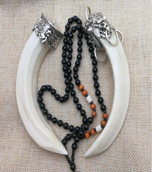 

natural wild boar tooth pendant inlaid with silver accessories animal teeth pendant personal hand piece to ward off evil spirits3171375
