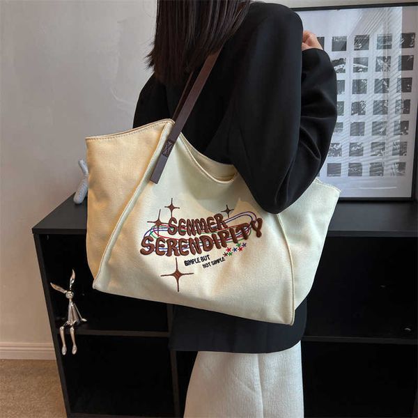 

designer tote bags for women with large capacity new high-end tote niche single shoulder bag for class commuting bag portable canvas bag cas