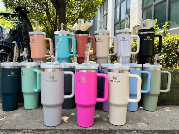 

light pink stanley quencher h2.0 40oz stainless steel tumblers cups with silicone handle lid and straw big capacity car mugs vacuum insulate