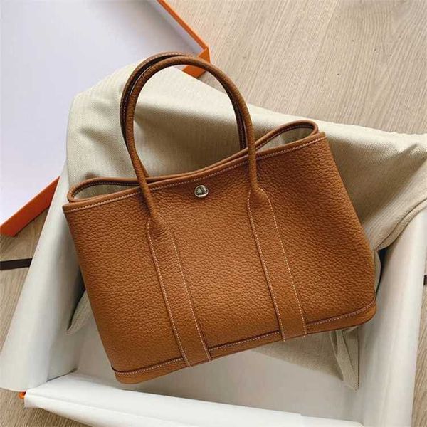 

designer authentic handbag hemrres classic garden party tote bag female large capacity commuting temperament mommy middle aged mom 6mcg
