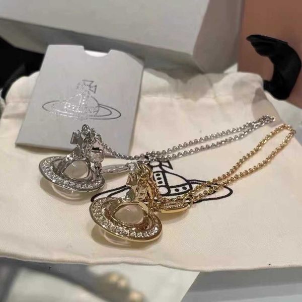 

the empress dowager the west is silver full of diamonds three-dimensional star rings transparent beads and a large saturn sweater necklace