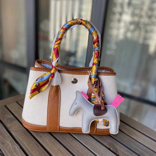 

classic hemrres tote bags garden party new 2023 spring canvas with layer cowhide garden bag color contrast fashion handbag versatile messeng