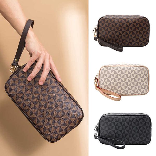 

fashion printed grab bag for women in korean version 2023 new easy to carry mobile phone change bag handbag travel wash bag trend