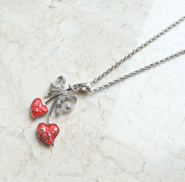 

silver full diamond bow double peach heart saturn necklace07860132