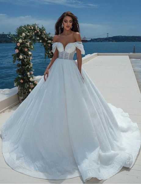 

2021 new white aline wedding dresses african bridal gown off shoulder plus size chapel train button back middle east6126628