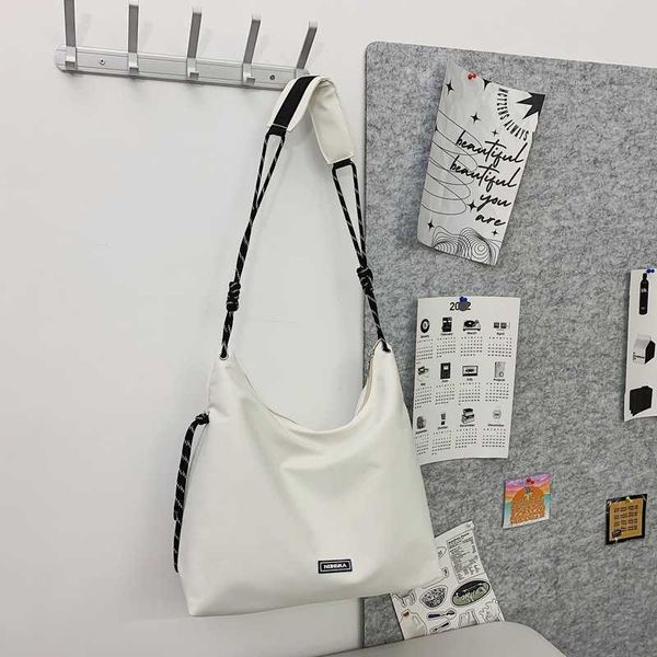 

simple and casual tote bag for women with large capacity sports style crossbody bag student class trend spring shoulder bag