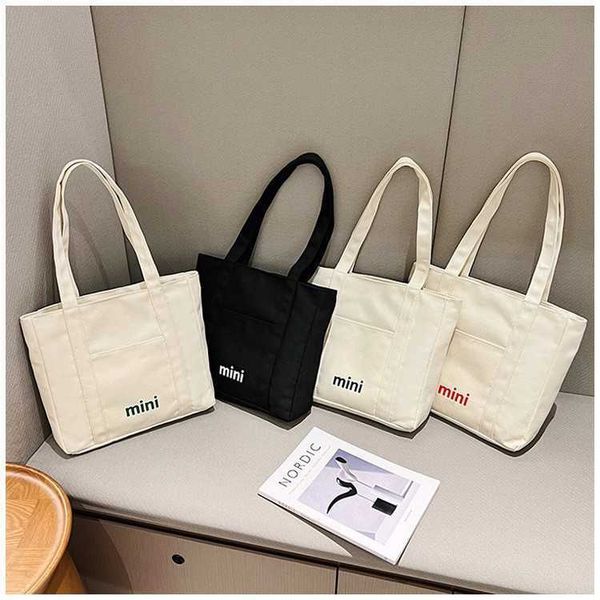 

new canvas bag female student leisure shopping shoulder bag large capacity simple letter handheld tote bag