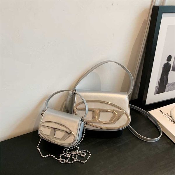 

30% off handbag designer 2023 xiaozhong design dingdang spring/summer portable underarm spicy girl style silver shoulder crossbody women&#03