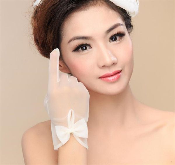 

2020 short simple wedding bridal gloves with bow whiteivory tulle sheer wrist length full finger wedding party glove8069894, White