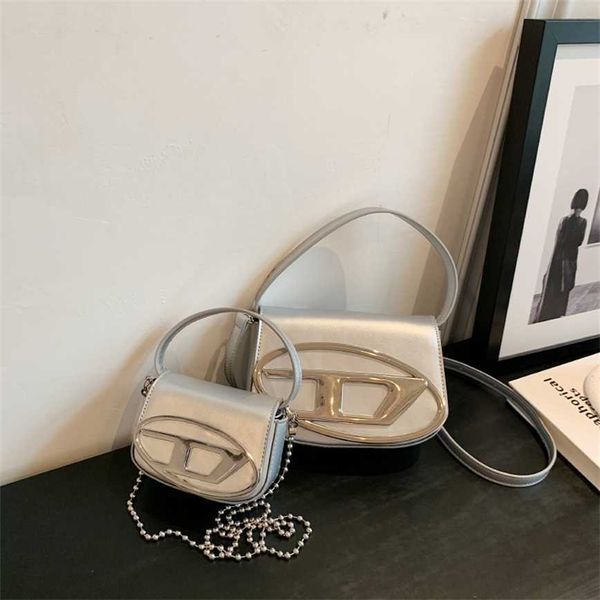 

68% off 2023 new bagdesigner xiaozhong design dingdang spring/summer portable underarm spicy girl style silver shoulder crossbody women&#039