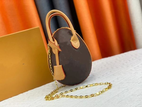 

spring/summer 2023 fashion design women's new dinosaur egg bag shock canvas oval with cowhide trim and mini chain shoulder strap