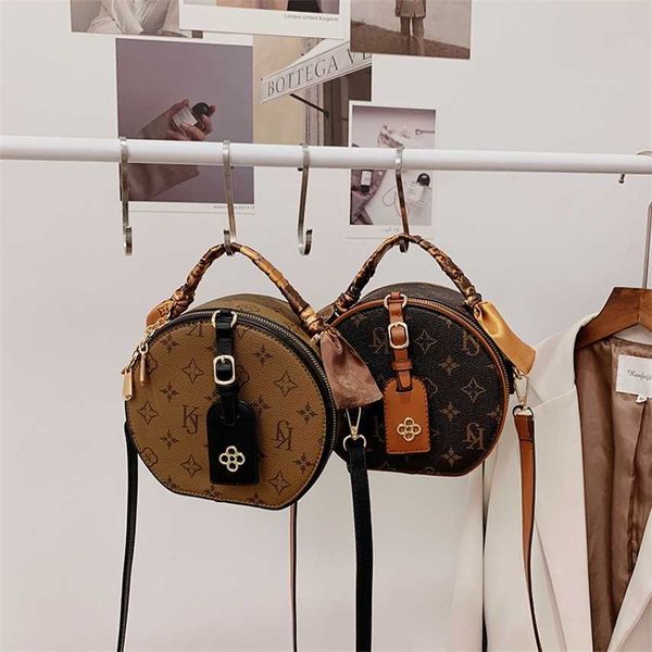 

68% off 2023 new bagdesigner small women's new simple one shoulder crossbody french round cake old flower bag