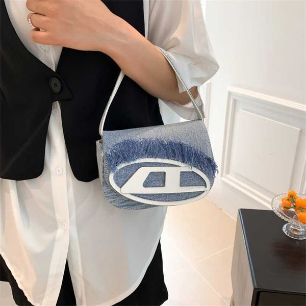 

68% off 2023 new bagdesigner small design new dingdang women's pearlescent handbag underarm single shoulder denim crossbody bag