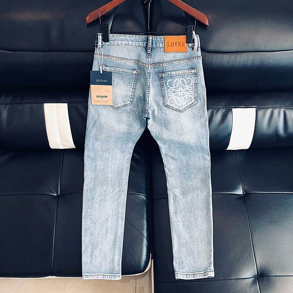 

high end quality baby blue jeans men's fashion brand autumn and winter pockets symmetrical printing slim fitting leggings
