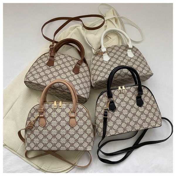

fashionable and minimalist shell bag 2023 new westernized commuter flower shoulder casual handbag female purses