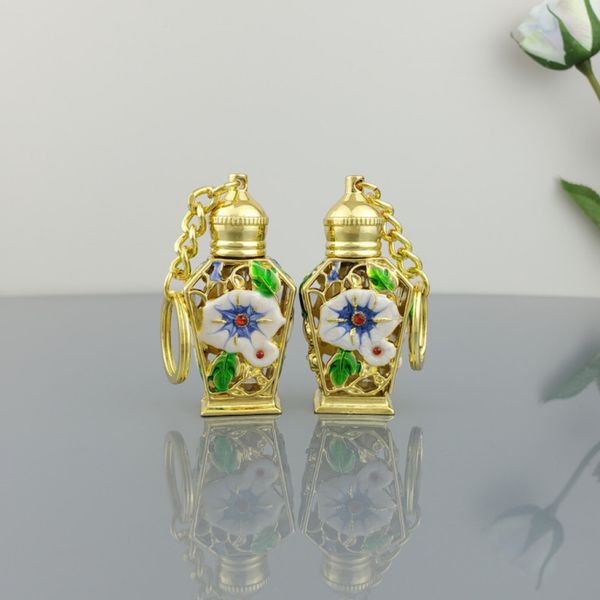

wholesale mini perfume bottles 3ml empty refillable essential oil bottles enamel flower middle east perfume bottle with key ring