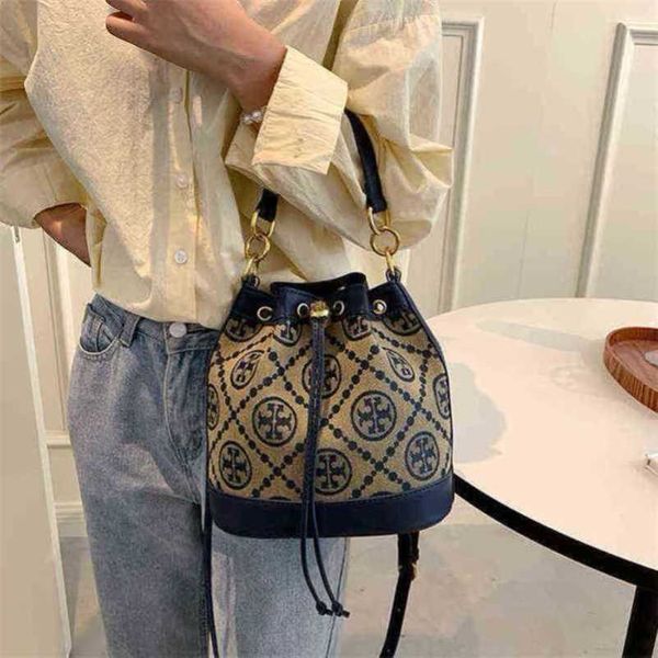 

2023 new luxury bags female canvas old flower drawstring contrast color bucket shoulder diagonal straddle