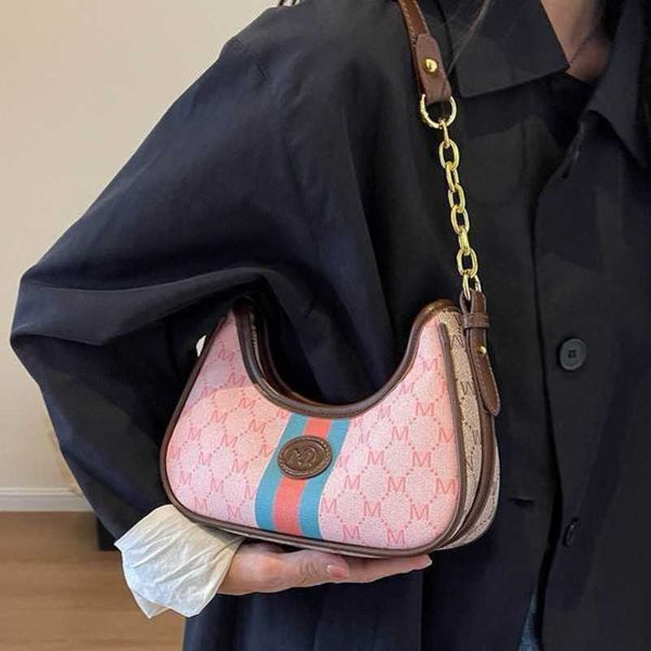 

2023 new factory direct sales this year's popular pink women's underarm high-end dumpling commuting chain crossbody bag