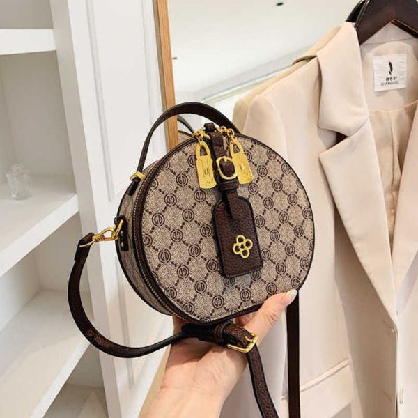 

2023 new factory direct sales high women's cake new trendy and fashionable printed crossbody shoulder small round bag