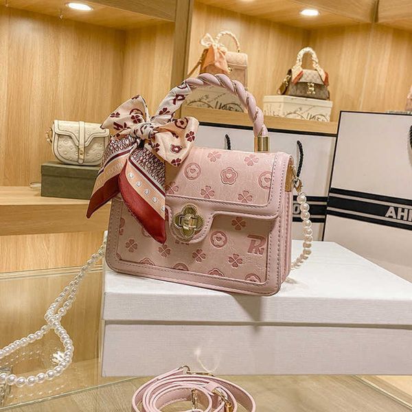 

2023 factory direct sales spring new live broadcast good style and high end embossed pink small square handheld one shoulder crossbody women