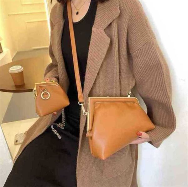 

2023 new luxury bags clip buckle shoulder messenger red irregular cow leather solid color