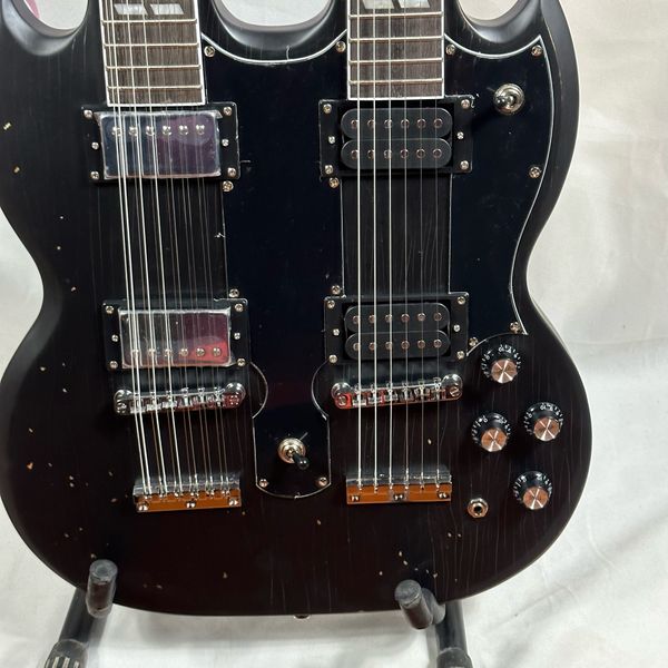 

black double neck sg guitar with stock two pickups on each fast ing